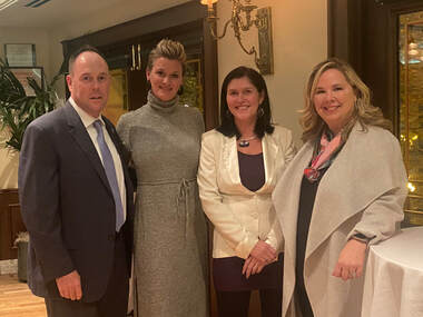 Ald. Matt O'Shea poses with Jessica McCarihan, AND Executive Director, Nancy Lang, AND Board President, and Rebecca Darr, CEO and President of WINGS Program, Inc.
